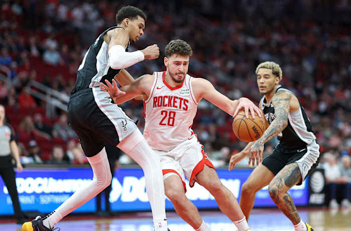 Rockets center Alperen Sengun (28) controls the ball as San Antonio Spurs center Victor Wembanyama (1) defends during the fourth quarter at Toyota Center.